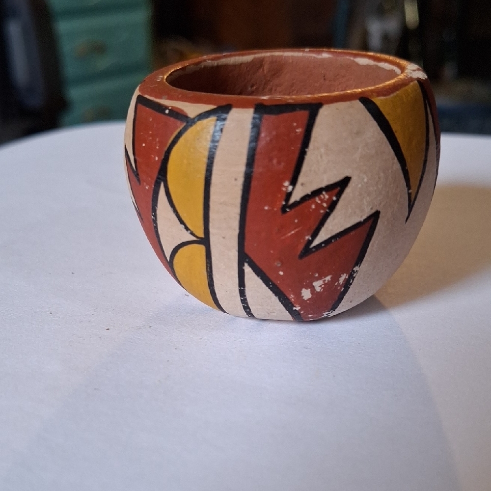 Handcrafted Pottery Bowl with Geometric Design 2in.signed.